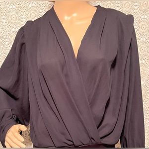 Long sleeve black lightweight bodysuit. Perfect for the office or a night out.